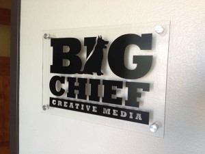 Acrylic sign with brushed aluminum standoffs