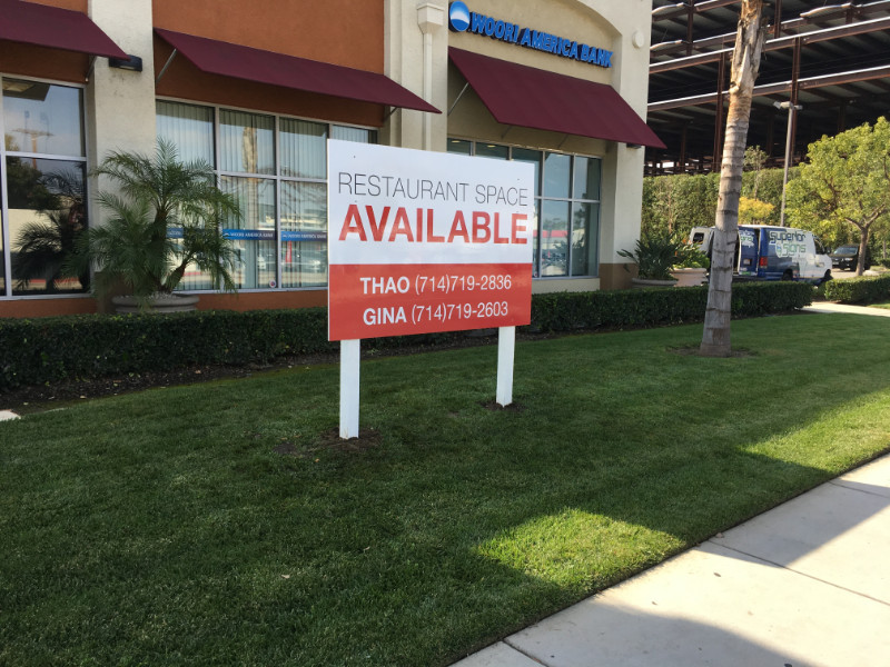graffiti-proof commercial property For Lease signs