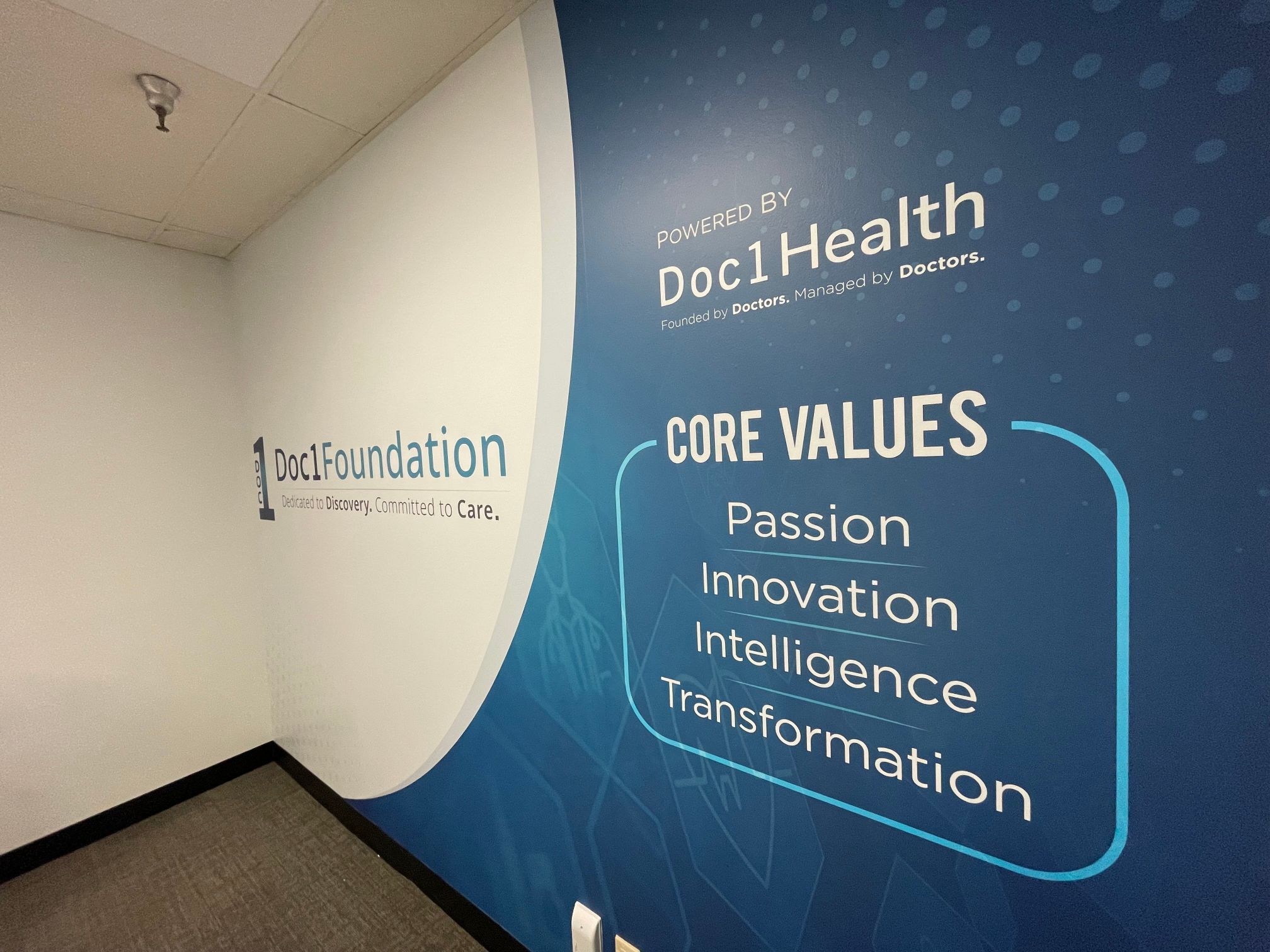 Wall Graphics Window Decals an Acrylic Directory Sign, and a Lobby Logo Brand Doc 1 Health Offices in Newport Beach CA