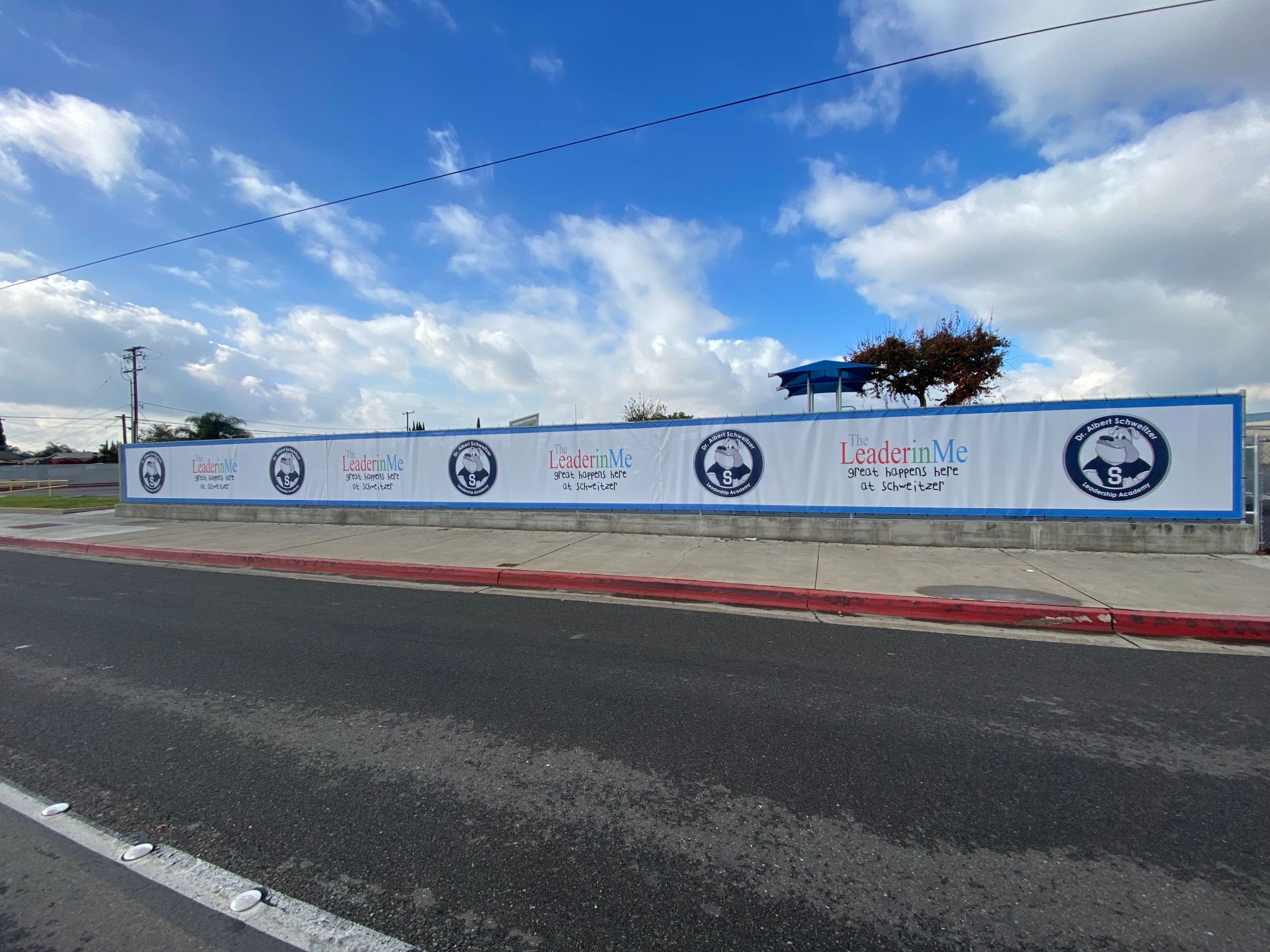 Mesh Fence Banners Decorate Chain Link Fencing at Anaheim CA Schools