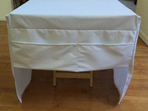 Back of table with lower pocket for storage or balance