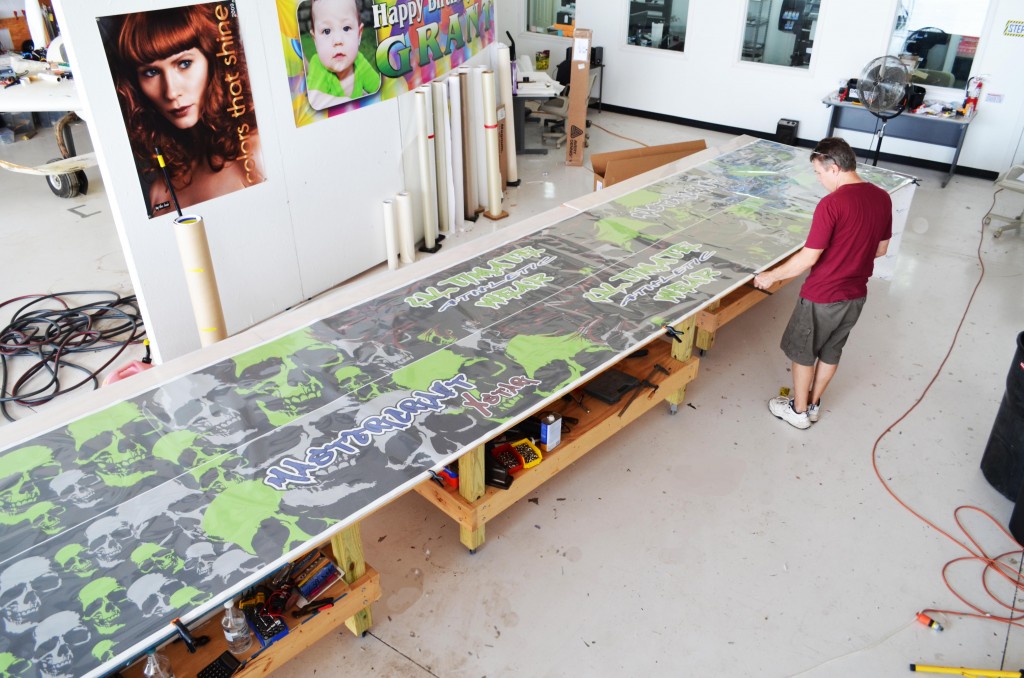 Before the initial wrap, the vinyl print is inspected and laminated for durability