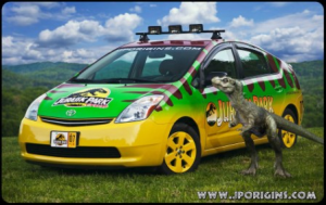 Toyota Prius with a vehicle wrap designed to look like a dinosaur.