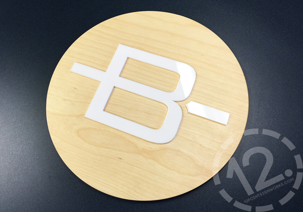The completed circle with the acrylic logo for Barbiere Orthodontics. 