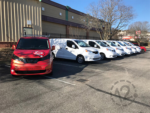 Leased vans prior to wrap installation by 12-Point SignWorks in Franklin, TN.