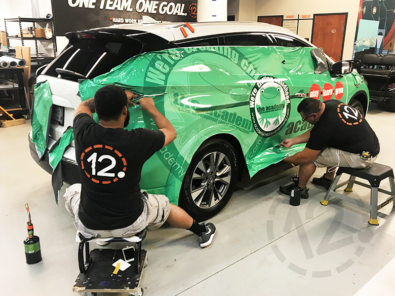 Vehicle wrap installation at 12-Point SignWorks in Franklin, TN.