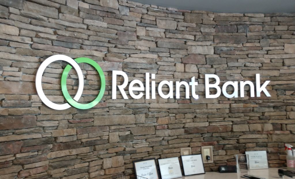 Custom Dimensional Acrylic Logo For Reliant Bank installed by 12-Point SignWorks