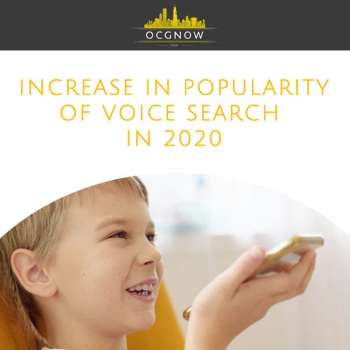 Boy laughing using voice search on mobile phone with parents