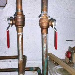 Shut-off valves going to washer and utility sink. Yours may look different.