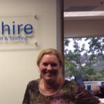 Premiere Hire's Leanne Abrahams in front of her new custom lobby sign
