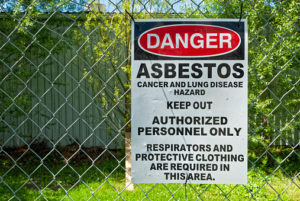 Asbestos sign warning people of the dangers ahead.
