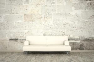 Sofa in front of a wall mural