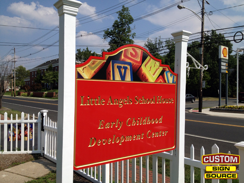Little Angels School House painted carved sign with digital print.