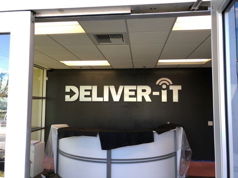 custom foam lobby sign with brushed metal face