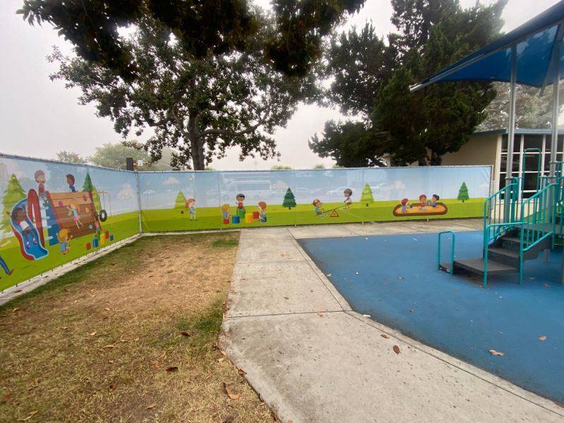 mesh fence banners with playground graphics for elementary schools in orange county, ca
