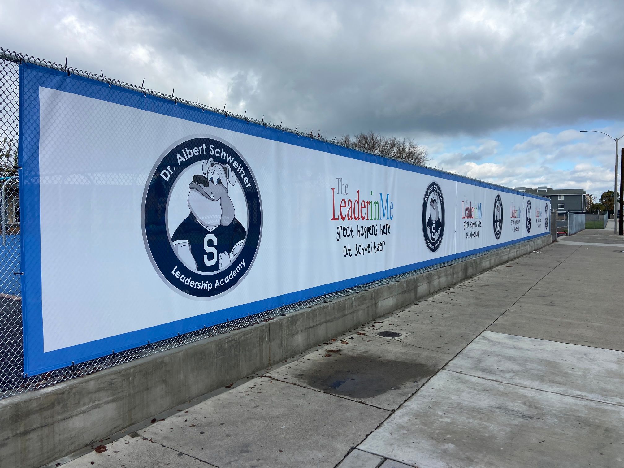 Mesh Fence Banners Decorate Chain Link Fencing at Anaheim CA Schools
