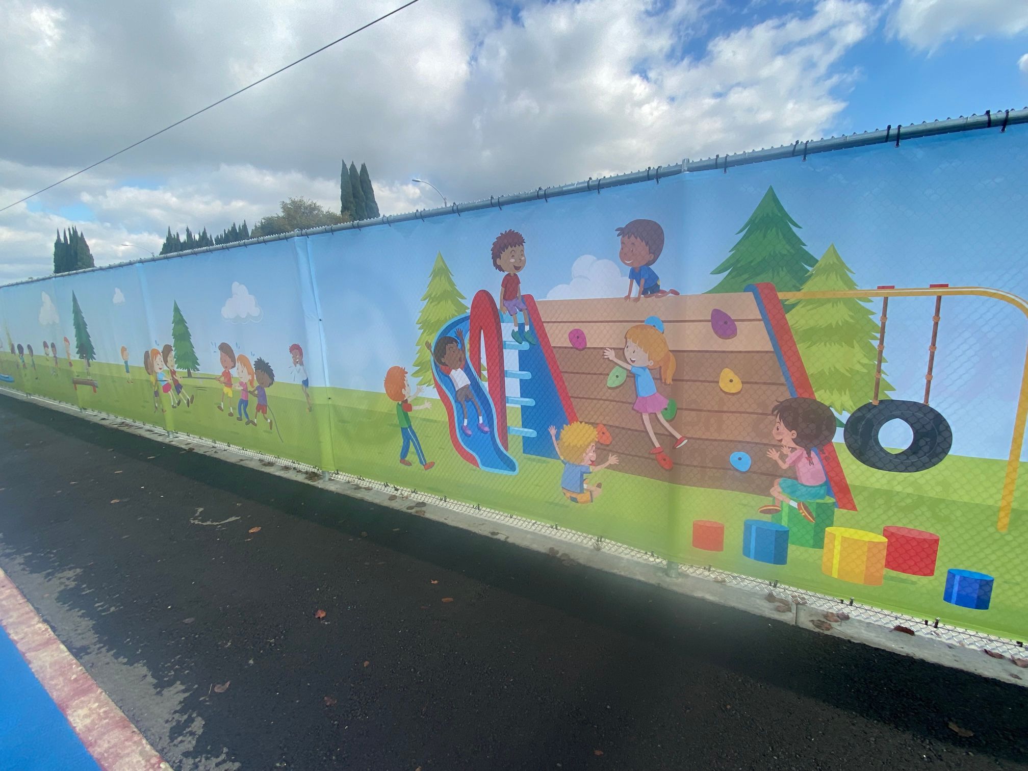 Mesh Fence Banners Decorate Chain Link Fencing at Anaheim CA Schools
