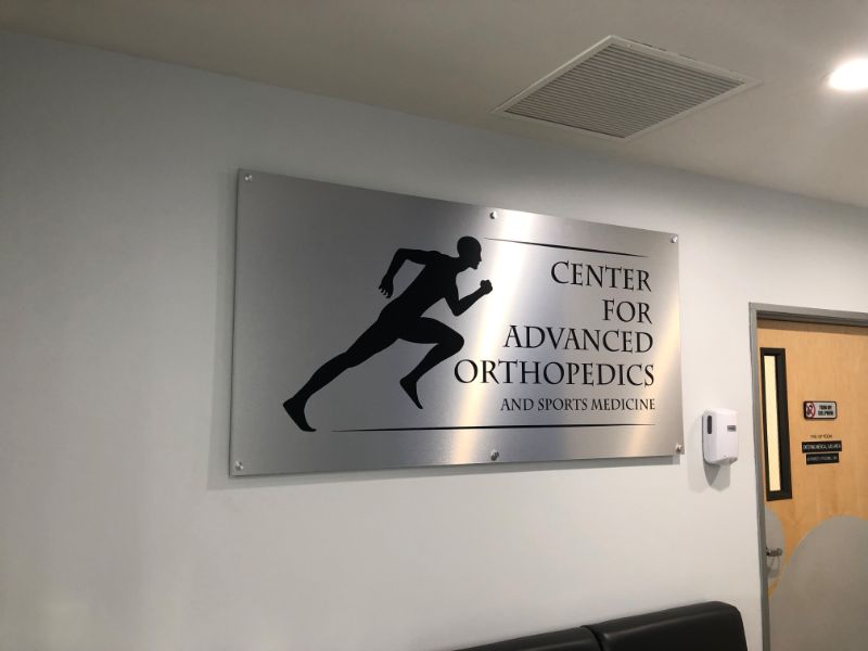Custom Made Brushed Metal Lobby Logo