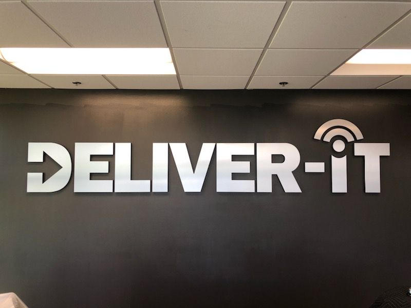 custom foam lobby sign with brushed metal face