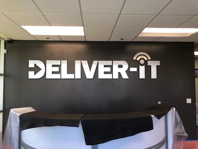 custom foam lobby sign with brushed metal face