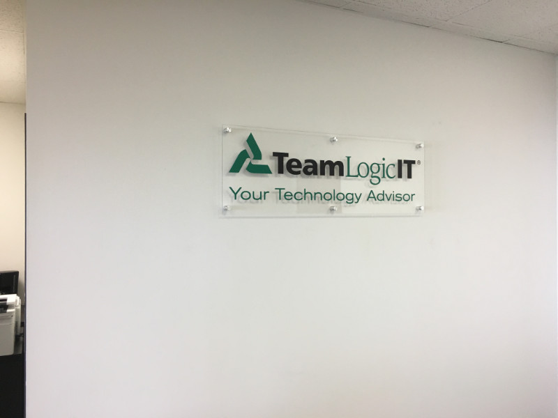 vehicle graphics and office lobby signs for franchisees in Orange County CA