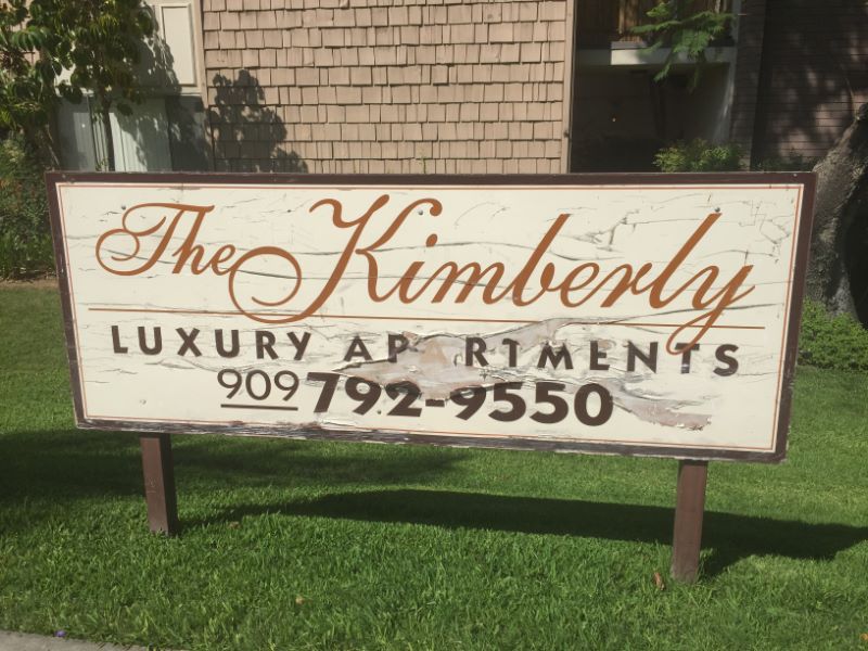 An old apartment complex sign looks bad