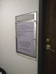 Side view of office directory sign