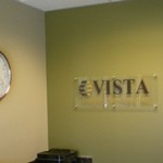 Acrylic lobby sign with cut-vinyl letters and logo