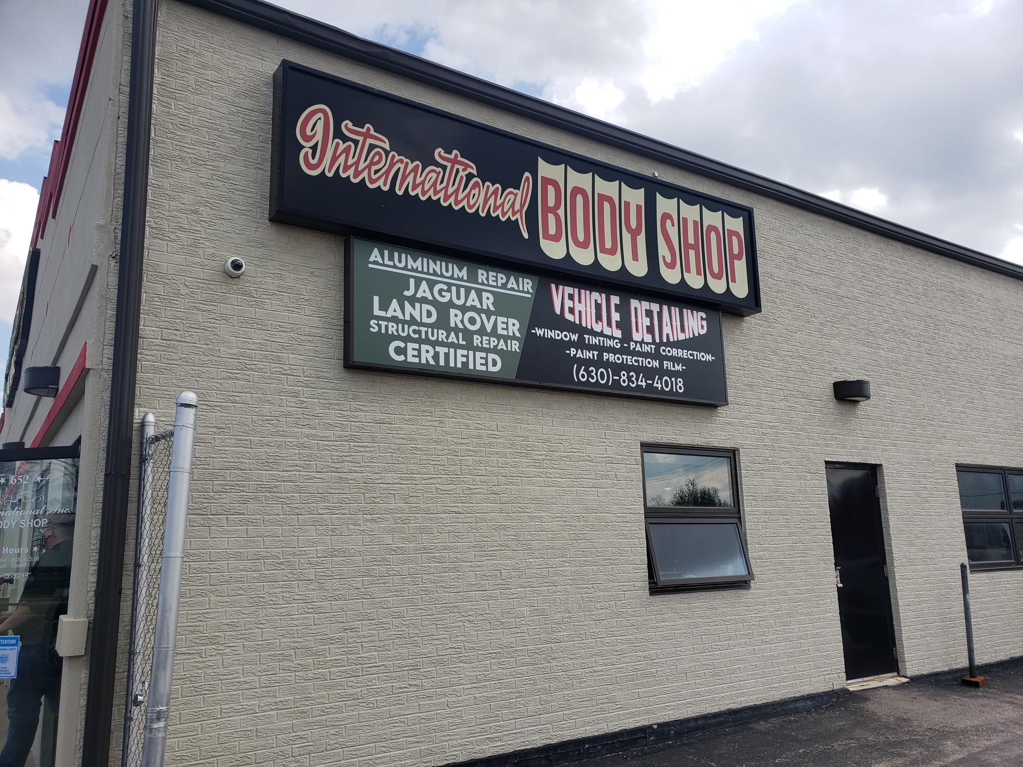 Elmhurst -International Body Shop Adds New Facing to Existing Cabinet Sign!