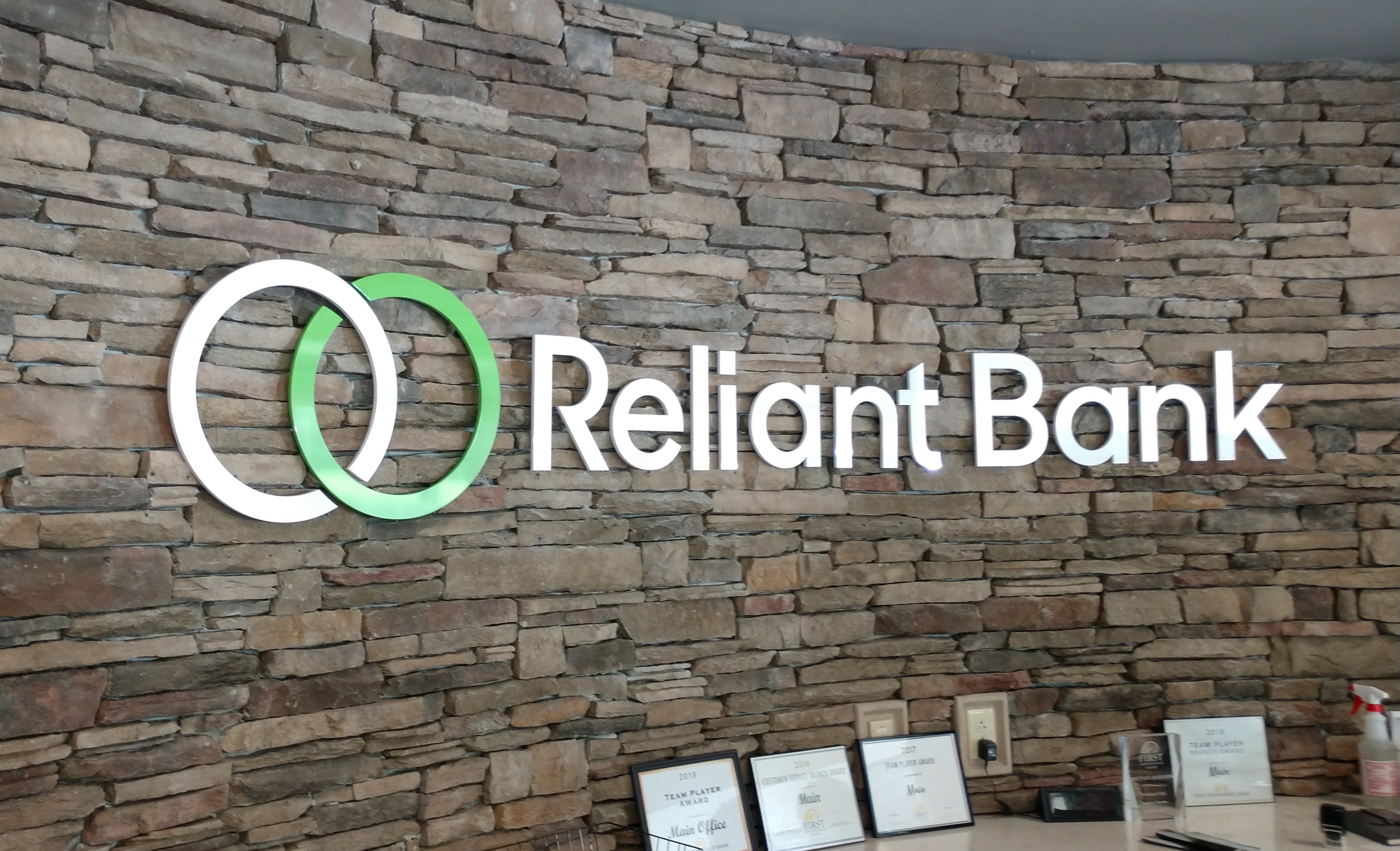 Custom Dimensional Acrylic Logo For Reliant Bank installed by 12-Point SignWorks Custom Dimensional Acrylic Logo For Reliant Bank installed by 12-Point SignWorks
