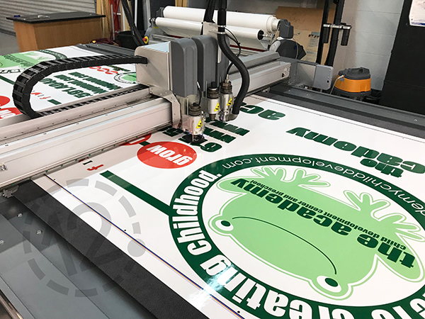 Contour cut decals for The Academy Preschools bus wrap by 12-SignWorks in Franklin, TN.