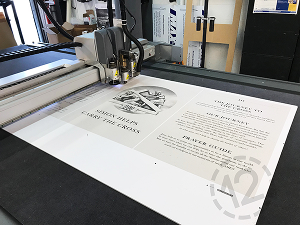 V-Cut tool cutting foam core signs on our flatbed cutter. 12-Point SignWorks - Franklin, TN
