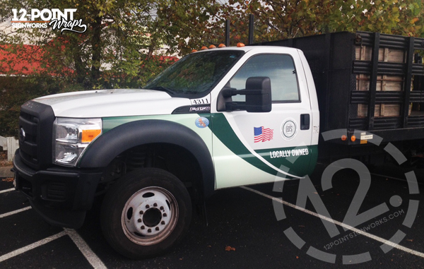 The cab on this Ford F-450 has custom cut vinyl graphics and cut decals. Although we only had the cab to work with, it still looks like the other vehicles in the fleet. 