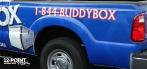 We zoomed in a little to show you the carbon fiber print on the truck, as well as the ghosted shape of the storage unit and a photo of an actual storage box.