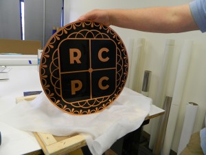Copper lobby sign for Russ Cook & Associates
