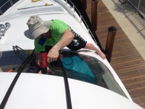 Heat shrinking Huper Optik film to windsheild while being supspended by ropes