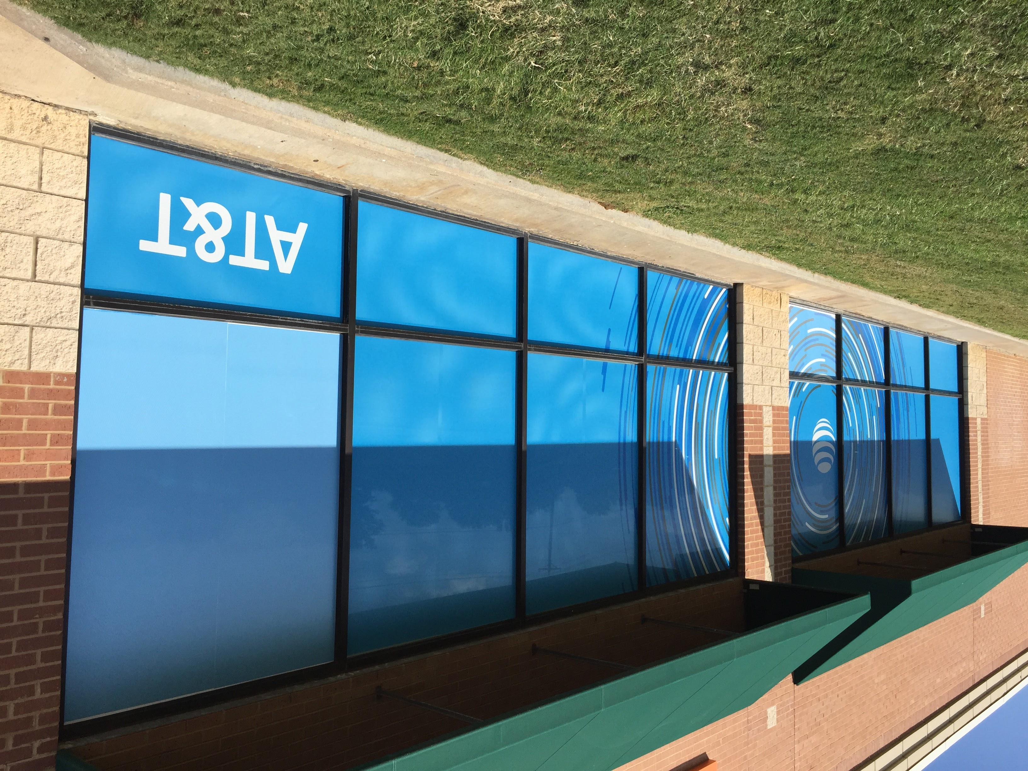 Vinyl signage on exterior glass to help advertising for AT&amp;T in Dallas TX