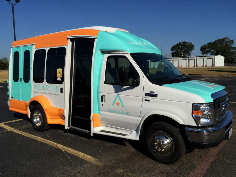 Custom Vinyl Bus Wrap for Heartis Assisted Living in Longview, TX