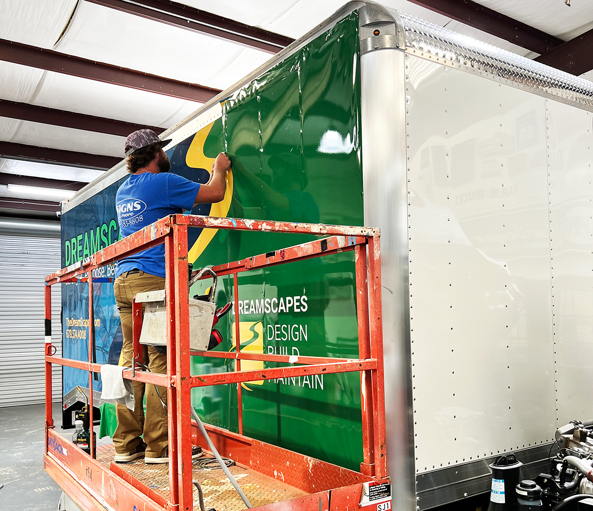 Wrapping a Box Truck on Scissor Lift in Cartersville - Signs and More