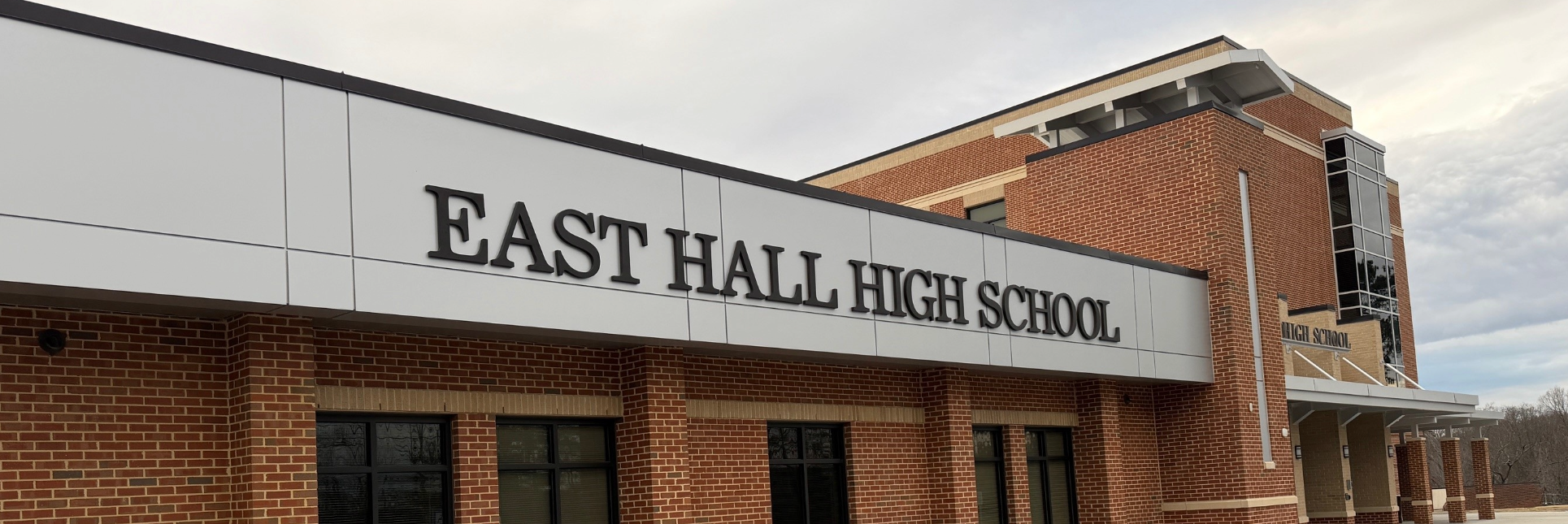 East Hall High School dimensional letters installation on exterior building facade by Signs and More in Georgia