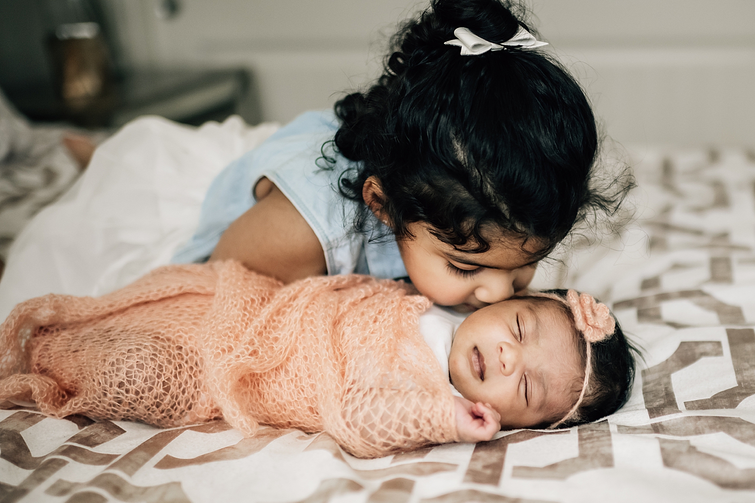 infant with sibling