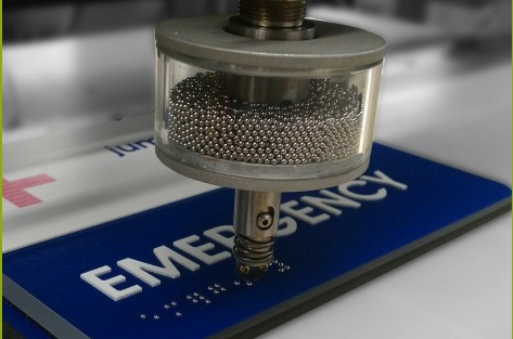 ADA Signs use small spheres called rasters inserted into drilled holes