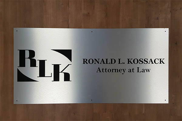 Tempe, AZ - Brushed Metal Lobby Sign for Kossack Law Firm | Sign Company News