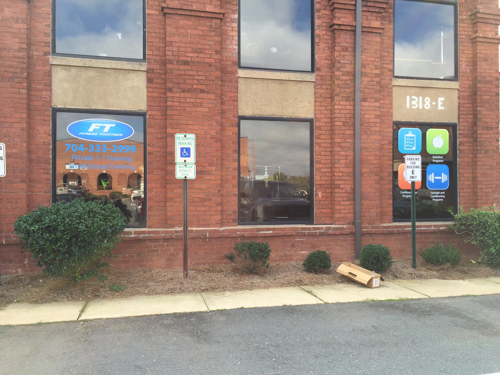 Window Graphics for a Local Fitness Together Company in Charlotte NC, using Printed Vinyl and Cut Graphics