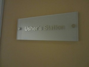 Office sign on plexiglass