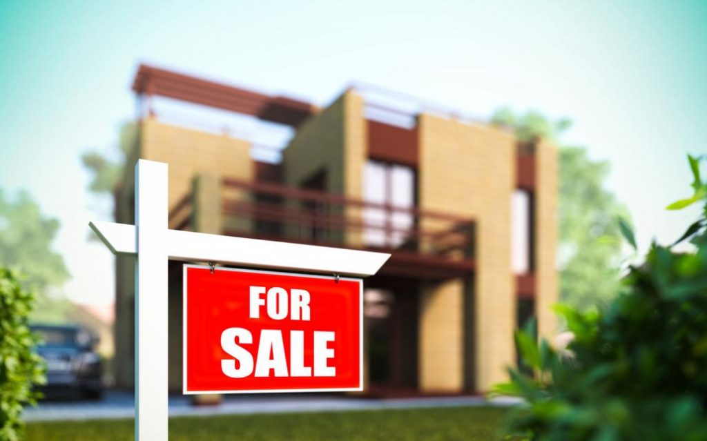  Panel and post sign in front of a house