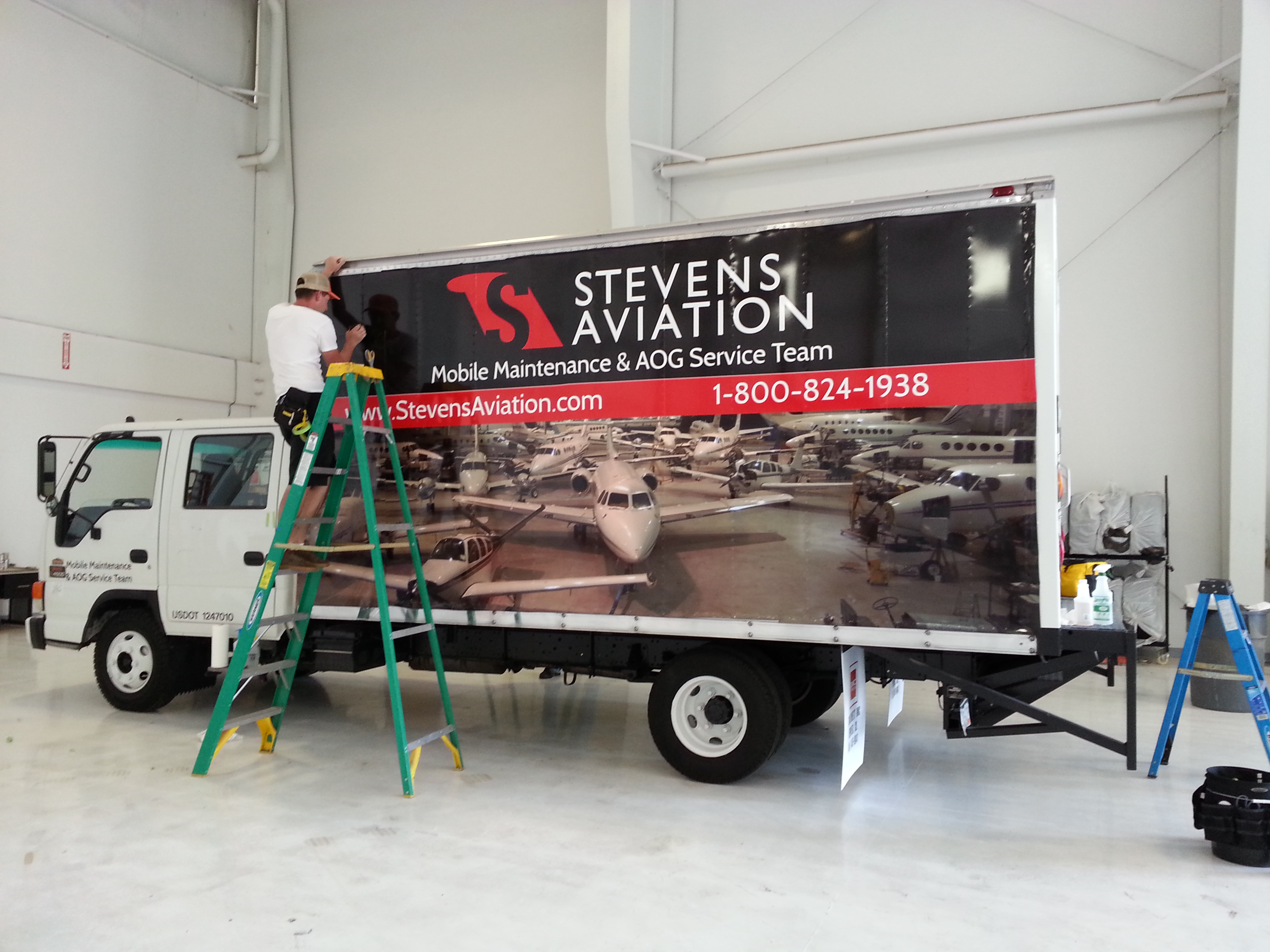 On Site Vehicle Truck Wrap Installation at Rocky Mountain Metropolitan Airport in Broomfield, CO